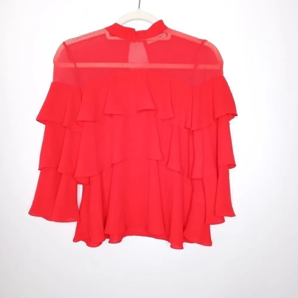Patrizia Luca red top